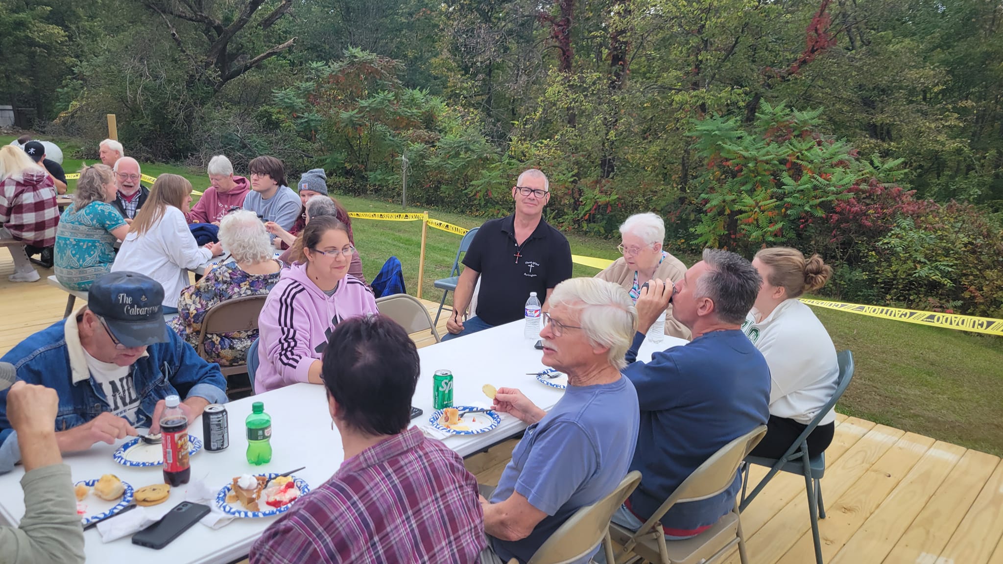 Outdoor church gathering with congregation members